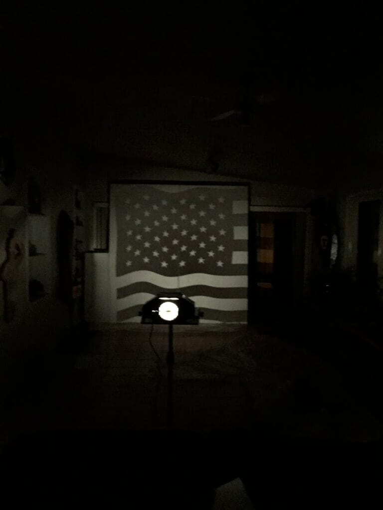 Projecting the source art onto plywood to sketch out the design in Sharpie